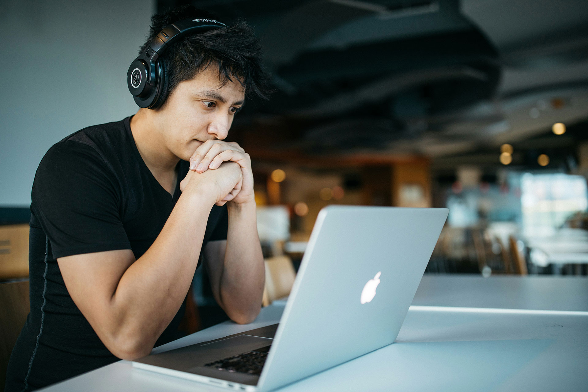 Accipio - Man at his Macbook